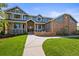 Charming two-story home with a well-manicured lawn and inviting front entryway at 188 S Rogers Way, Golden, CO 80401