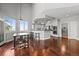 Open kitchen area with stainless appliances, breakfast bar, wood floors and backyard access at 188 S Rogers Way, Golden, CO 80401