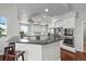 Modern kitchen with granite countertops, stainless steel appliances, and white cabinetry at 188 S Rogers Way, Golden, CO 80401