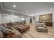 Finished basement with an expansive seating area and wood-look flooring at 188 S Rogers Way, Golden, CO 80401