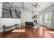 Spacious living room with hardwood floors, fireplace, and abundant natural light from many windows at 188 S Rogers Way, Golden, CO 80401
