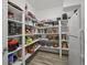 Walk-in pantry features ample shelving for storage and a second refrigerator at 188 S Rogers Way, Golden, CO 80401