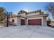 Beautiful home with a three-car garage and a basketball hoop in the driveway at 6928 S Eaton St, Littleton, CO 80128