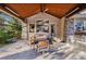 Covered outdoor dining area with a grill and a spacious table, perfect for outdoor gatherings at 6928 S Eaton St, Littleton, CO 80128