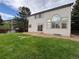 Well-maintained backyard featuring lush green grass and a patio area at 10027 Sylvestor Rd, Highlands Ranch, CO 80129