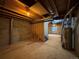 Unfinished basement awaits your creative design with exposed beams and utility hookups at 10027 Sylvestor Rd, Highlands Ranch, CO 80129