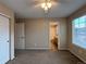 Bedroom featuring a ceiling fan, closet and an entrance to a bathroom at 10027 Sylvestor Rd, Highlands Ranch, CO 80129
