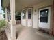 Inviting front porch with neutral paint and a covered entryway at 10027 Sylvestor Rd, Highlands Ranch, CO 80129