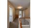 Bright hallway with carpet flooring, a built-in cabinet, and views into adjacent rooms at 10027 Sylvestor Rd, Highlands Ranch, CO 80129