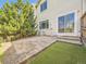 Outdoor patio features patterned concrete, low maintenance turf, and mature landscaping at 12265 E 2Nd Dr, Aurora, CO 80011