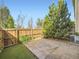 Enclosed backyard with concrete patio, artificial turf and wood fence at 12265 E 2Nd Dr, Aurora, CO 80011
