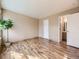 Spacious bedroom featuring stylish wood floors and a peaceful ambiance with natural light at 12265 E 2Nd Dr, Aurora, CO 80011