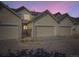 Charming townhome featuring an attached garage and meticulous landscaping for added curb appeal at 12265 E 2Nd Dr, Aurora, CO 80011