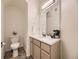 Cozy half-bathroom with a modern vanity and stylish décor at 12265 E 2Nd Dr, Aurora, CO 80011