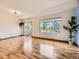 Spacious living room with wood floors, large windows and access to the back yard at 12265 E 2Nd Dr, Aurora, CO 80011