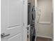 Stackable washer and dryer in dedicated laundry closet at 155 S Monaco Pkwy # 114, Denver, CO 80224