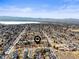 Neighborhood aerial view showing nearby lake and mountains in the background at 4621 S Perry Way, Denver, CO 80236