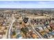 Residential aerial shot highlighting a neighborhood, nearby school, and green spaces at 4621 S Perry Way, Denver, CO 80236