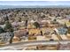 Aerial neighborhood shot of well-maintained homes with mature trees, landscaped yards at 4621 S Perry Way, Denver, CO 80236