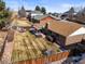 Aerial view showcasing the property's expansive backyard, covered patio, and mature landscaping at 4621 S Perry Way, Denver, CO 80236