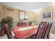 Traditional dining room with wood furniture and neutral walls at 4621 S Perry Way, Denver, CO 80236