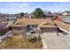 Ranch style home with a well maintained lawn and landscaping, a new roof, and an attached two-car garage at 4621 S Perry Way, Denver, CO 80236