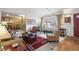 Inviting living room featuring a bay window, comfortable seating, and an open layout at 4621 S Perry Way, Denver, CO 80236