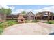 Large backyard patio, outdoor fireplace and private garage with updated overhead doors at 3580 Locust St, Denver, CO 80207