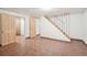 Open basement space with tile flooring and a staircase at 3580 Locust St, Denver, CO 80207