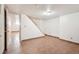 Large basement area with tile flooring and staircase access at 3580 Locust St, Denver, CO 80207