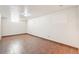 Unfinished basement area with tile flooring and a small window at 3580 Locust St, Denver, CO 80207