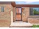 The entrance to a brick home at 3580 Locust St, Denver, CO 80207