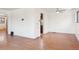 Spacious living room with hardwood flooring, ceiling fan, and neutral wall paint at 3580 Locust St, Denver, CO 80207