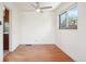 Bright room with hardwood floors, a ceiling fan, and a view from the window at 3580 Locust St, Denver, CO 80207