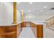 Finished basement wet bar with wooden cabinetry and countertops at 3810 Urban St, Wheat Ridge, CO 80033