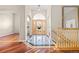 Spacious foyer with marble floors, a chandelier, and beautiful woodwork at 3810 Urban St, Wheat Ridge, CO 80033