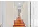 Hallway with hardwood floors, and archway details at 3810 Urban St, Wheat Ridge, CO 80033