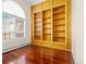 Bright office featuring built-in wooden shelving and hardwood floors at 3810 Urban St, Wheat Ridge, CO 80033