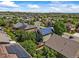 Expansive aerial view of a neighborhood featuring homes equipped with modern solar panels at 13445 Kearney St, Thornton, CO 80602