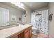 Functional bathroom featuring a vanity, mirror, and a shower/tub with a whimsical bunny shower curtain at 13445 Kearney St, Thornton, CO 80602