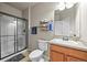 Clean bathroom with walk-in shower, modern fixtures, neutral colors, and tile flooring creates a serene atmosphere at 13445 Kearney St, Thornton, CO 80602