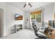 This bedroom offers multiple monitors for work and a large window for natural light, great for an office at 13445 Kearney St, Thornton, CO 80602