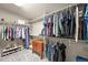 Spacious walk-in closet with custom shelving, ample storage space, and well-organized design at 13445 Kearney St, Thornton, CO 80602