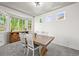 Bright dining area with a large window, stylish table, and comfortable seating for Gathering meals and gatherings at 13445 Kearney St, Thornton, CO 80602