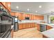 Spacious kitchen with stainless steel appliances, modern countertops, and ample cabinet space for all cooking needs at 13445 Kearney St, Thornton, CO 80602