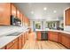 Modern kitchen featuring stainless steel appliances, spacious countertops, and abundant cabinet space for organization at 13445 Kearney St, Thornton, CO 80602