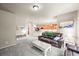 Inviting living room with open layout, flows to the kitchen with eat-in bar for an open concept feel at 13445 Kearney St, Thornton, CO 80602