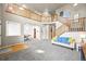 A spacious living room features a high ceiling, large staircase, light grey carpet, and view to the dining room at 13445 Kearney St, Thornton, CO 80602