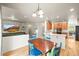 Open floor plan featuring kitchen, dining area, and living room allows easy flow and perfect for hosting guests at 13445 Kearney St, Thornton, CO 80602