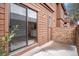 Exterior patio view with sliding glass door entry at 2685 S Dayton Way # 234, Denver, CO 80231